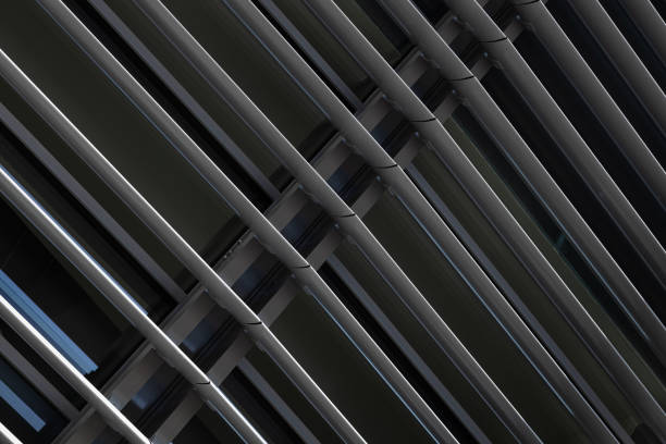 istock Angular view close-up of dark grey metal beams structure in fragment of building 1176152737
