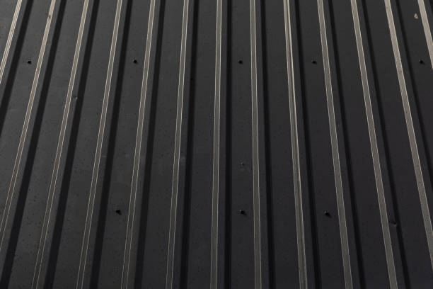 istock Front view of straight lines on black corrugated surface. 1176153743