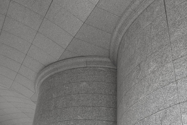 istock Bottom view of wide column and ceiling paved light grey granite tile 1176153931