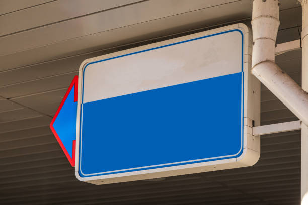 istock Close-up of blank white and blue signboard with pointer on left 1176153975