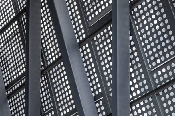 istock Metal surface with round openings bearing against iron girders 1176154302