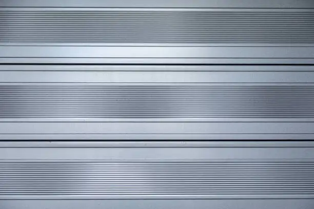 Close-up of shiny metallic surface with horizontal stripes