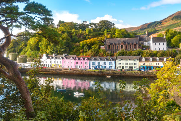Portree Isle of Skye morning amazing view flowers colored houses llake bay amazing view flowers colored houses llake bay isle of skye stock pictures, royalty-free photos & images