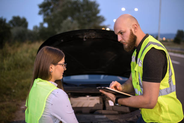 istock Road help helping to female driver in trouble 1176154807