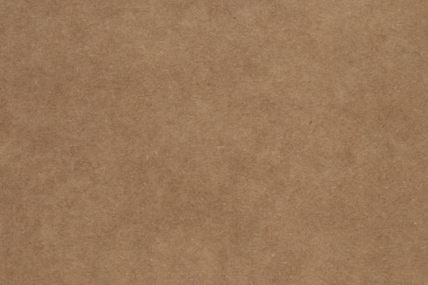 istock Dark brown paper box surface. Packaging, parchment texture, recycling, package background. Carton container. 1176155734