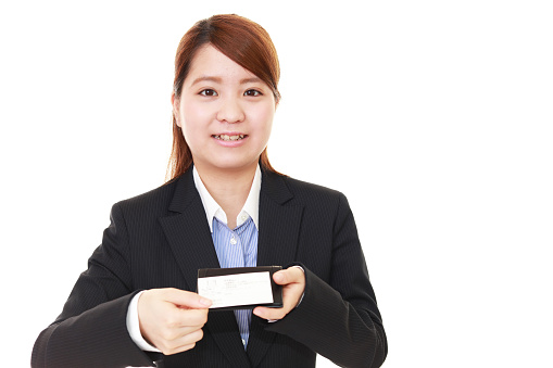 The woman exchanges the business cards