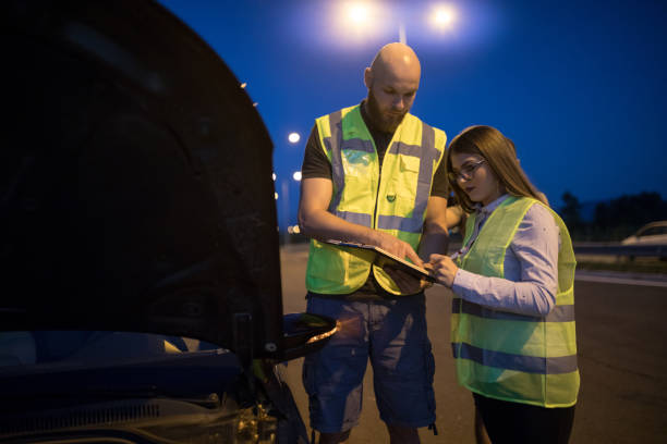 istock Road help helping to female driver in trouble 1176156189