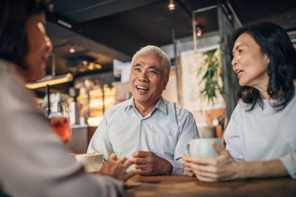 istock Friends drinking coffee in cafe 1176159647