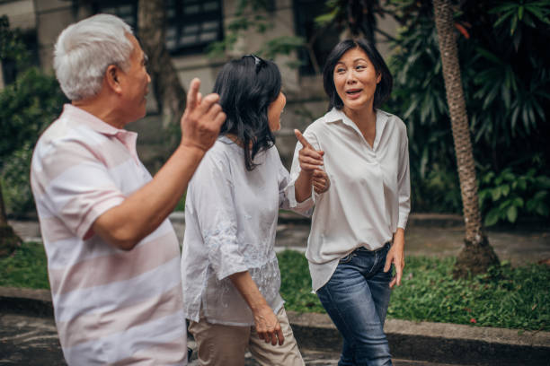 istock Senior people walking in park 1176160633