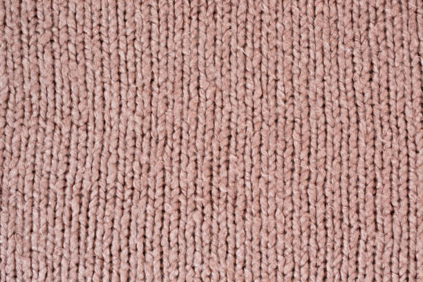 istock Knitted seamless texture fabric. Sweater close up. Pale pink 1176169308