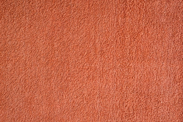 istock Smooth seamless texture of a terry towel. Coral color 1176169338