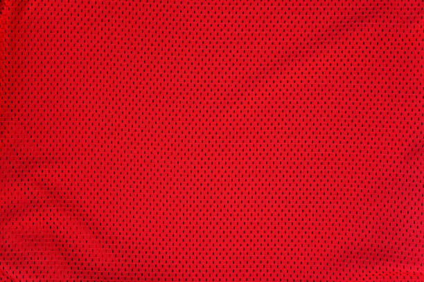 istock Textured bright red mesh fabric. Folds 1176169602