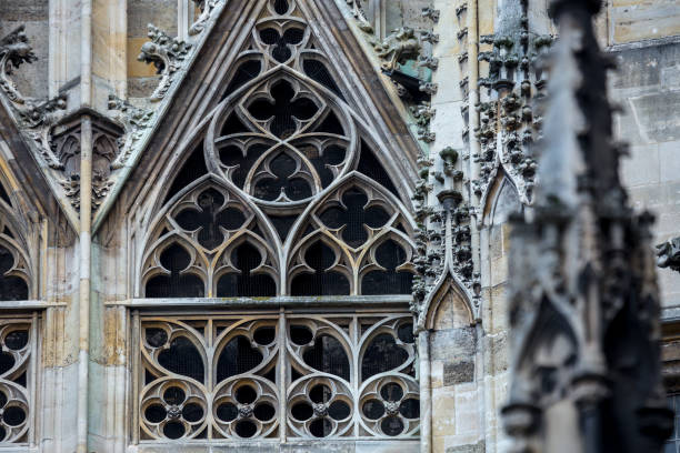 Elements of Gothic architecture. Gable wall rose(rosette) windows on the facade. Pinnacles, crabbs and other chiseled stone of an ancient medieval cathedral. St. Stephen's Cathedral. Vienna. Austria