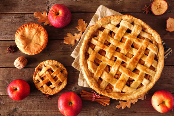 istock Homemade autumn apple pies, top view table scene over rustic wood 1176182477