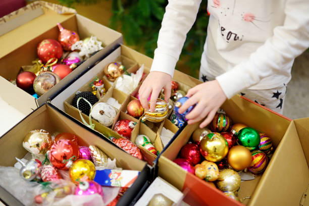 Variety of colorful Christmas baubles in a boxes. Trimming the Christmas tree. stock photo