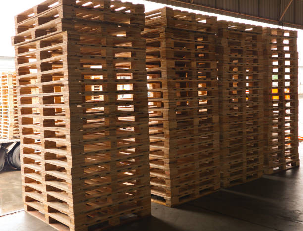 istock Wooden pallets stack at the freight cargo warehouse for transportation and logistics industrial 1176197354