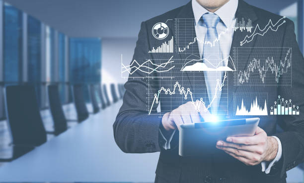 istock Man using tablet in meeting room, infographics 1176197741