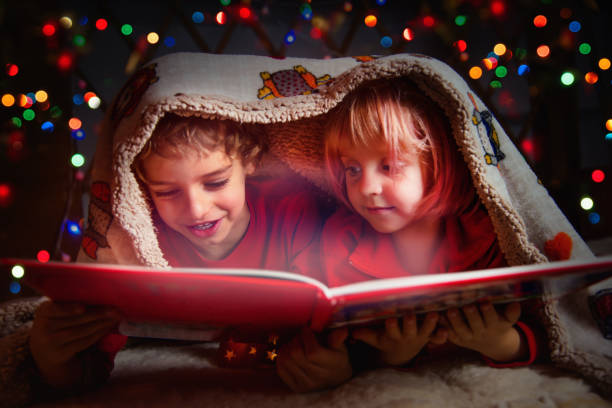 istock Brother and Sister Reading Magic Book at Bedtime 1176197843