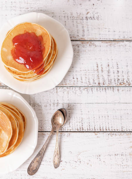 istock Tasty breakfast. Pancakes with strawberry jam and butter. 1176199264