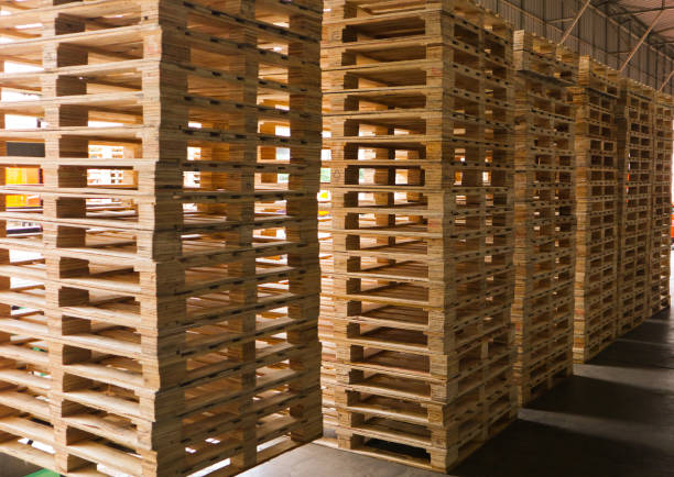 istock Wooden pallets stack at the freight cargo warehouse for transportation and logistics industrial 1176199344