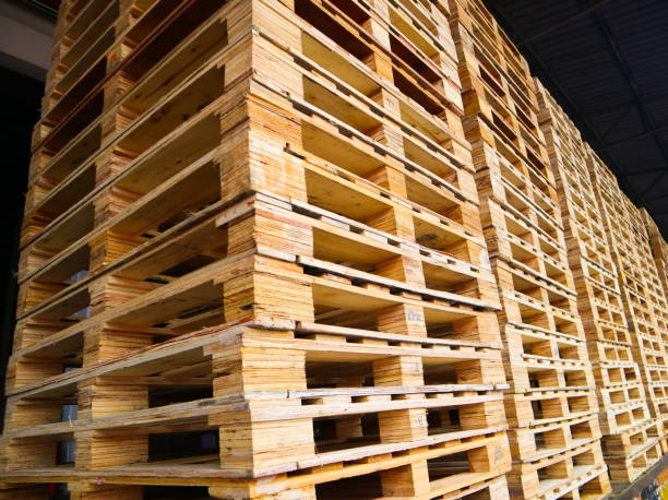 istock Wooden pallets stack at the freight cargo warehouse for transportation and logistics industrial 1176201612