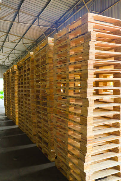 istock Wooden pallets stack at the freight cargo warehouse for transportation and logistics industrial 1176202099