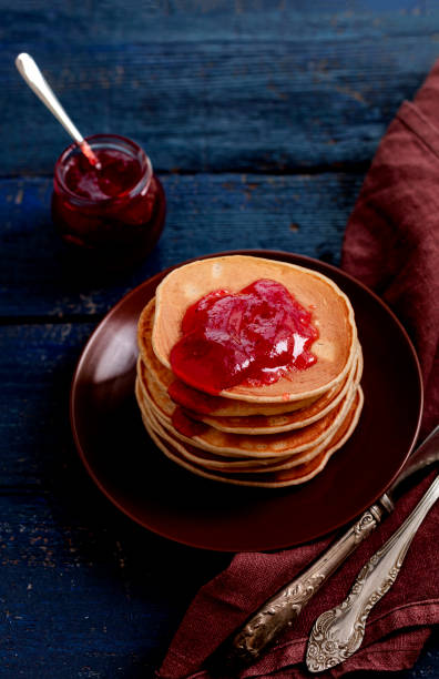 istock Tasty breakfast. Pancakes with strawberry jam and butter. 1176206036