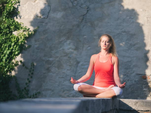 istock Woman Doing Yoga in the Park 1176206074