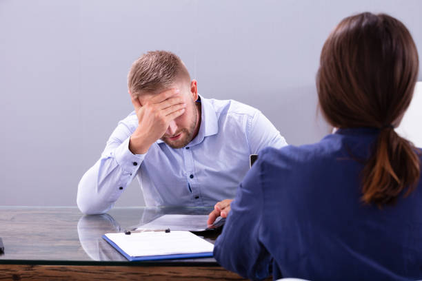 istock Unhappy Businessman Sitting At Interview 1176206278