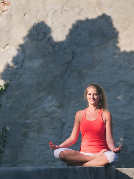 istock Woman Doing Yoga in the Park 1176206341