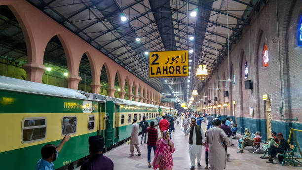 Passengers waiting for their train at Lahore Station stock photo