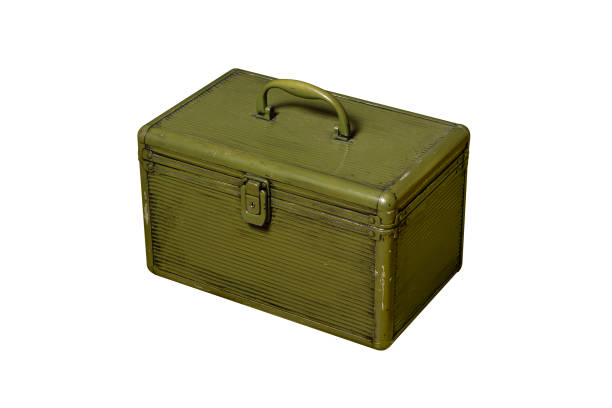 Old metal military box isolate on a white background. Green rusty drawer with handle and lock.