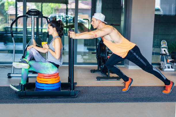 istock Young athletic couple having cross training in a gym 1176214852