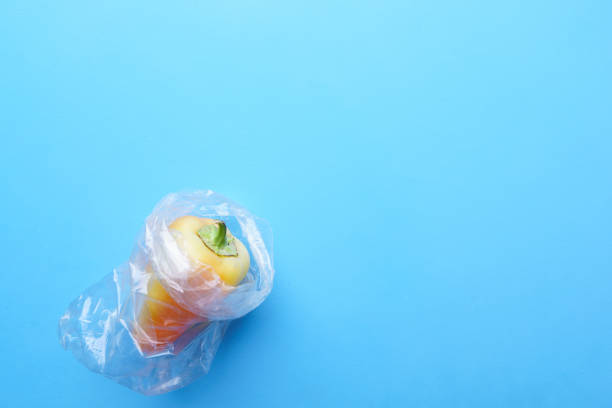 istock Yellow bell pepper wrapped in plastic bag 1176219186