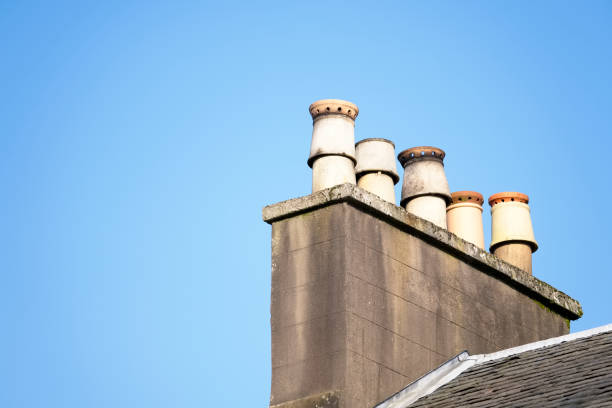 istock Chimney pots on old victorian house roof 1176219999