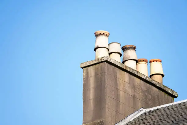 Chimney pots on old victorian house roof uk
