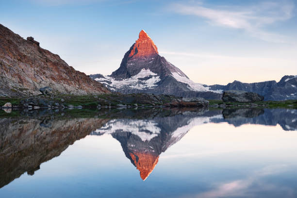istock Matterhorn and reflection on the water surface during sunrise. Beautiful natural landscape. Switzerland travel - image 1176220619