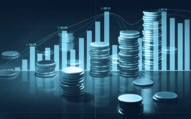 Photo of Coin Stacks and Blue Bar and Line Graphs on Black Background