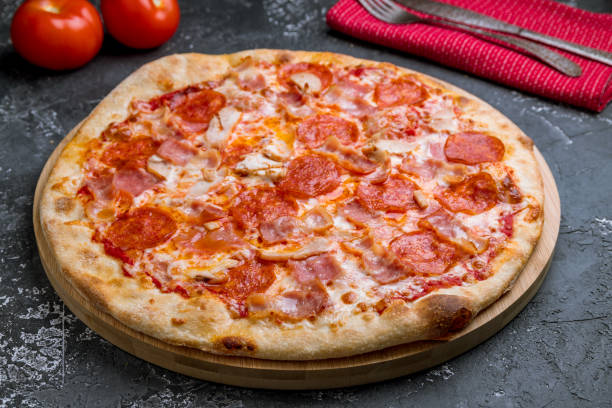 istock Italian meat pizza on grey concrete table 1176230663