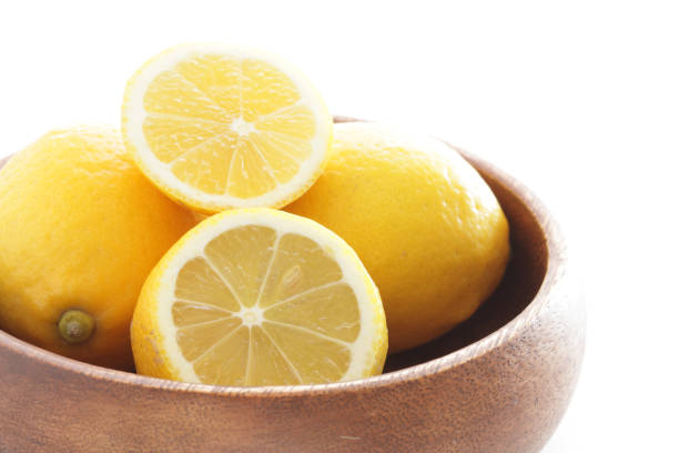 istock cut lemon on wooden plate 1176234112