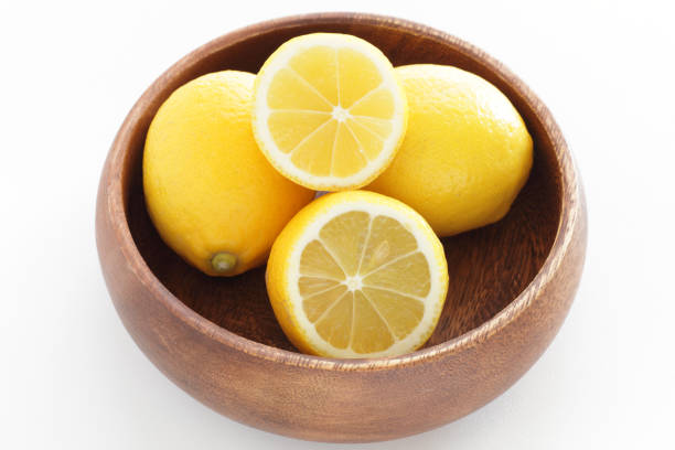istock cut lemon on wooden plate 1176234117