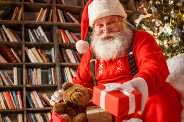 istock Santa Claus in the library christmas new year concept 1176237621