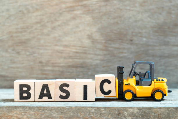 istock Toy forklift hold letter block c to complete word basic on wood background 1176239827