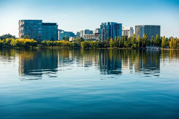 Afternoon scene of some high-rise buildings with contemporary designs across Lake Burley Griffin stock photo