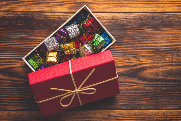 istock Christmas background, red gift box with multi color small gift box inside 1176243968