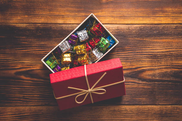 istock Christmas background, red gift box with multi color small gift box inside 1176243982