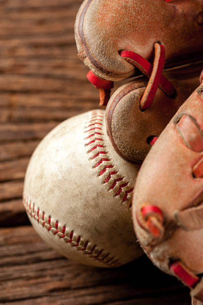 istock baseball on wooden desk 1176248901