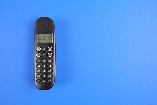istock Top view of cordless phone over blue background. 1176249004