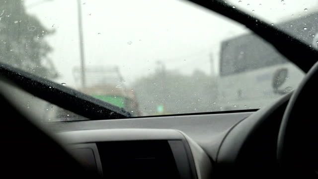 Car wiper working clean water drop on windshield
