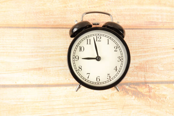 istock Time Punctuality Concept with black alarm clock. 1176250144